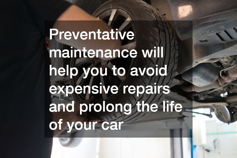 car mechanic rotating a tire